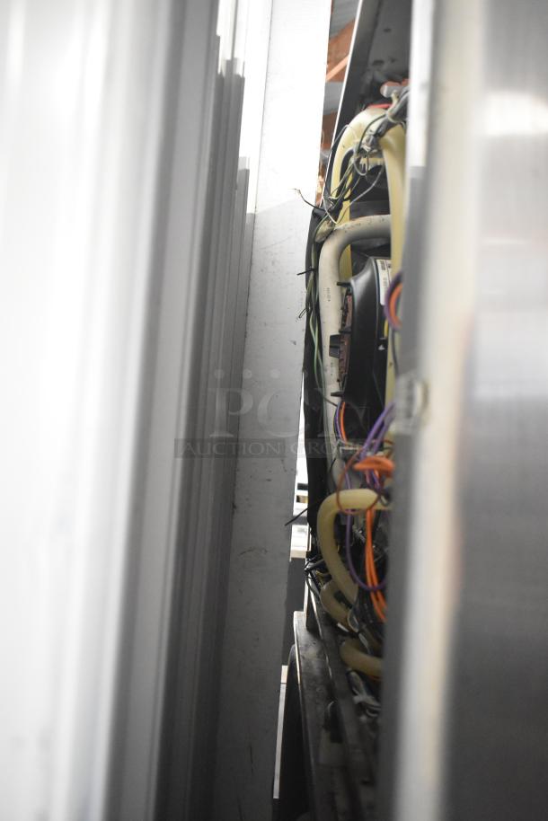 Interior view of Rational SCCWE62/SCCWE102 ovens showing wiring and structure detail. Electric, stainless steel, on casters.