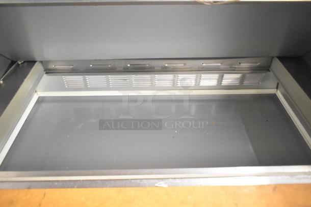 Beverage Air commercial salad prep table, mega top, Bain Marie style, on casters, 115 volts, good condition.