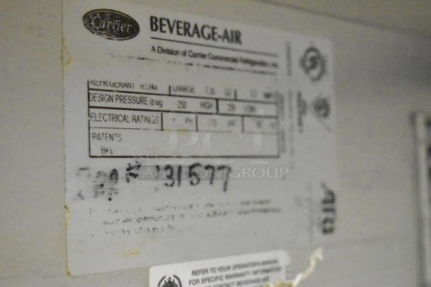 Beverage Air label on a commercial sandwich salad prep table, showing refrigerant type, design pressure, and electrical ratings.