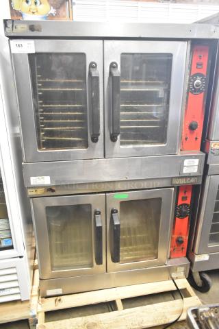 2 Vulcan full-size convection ovens with view-through doors, thermostatic controls, and multiple racks. Slight wear visible.