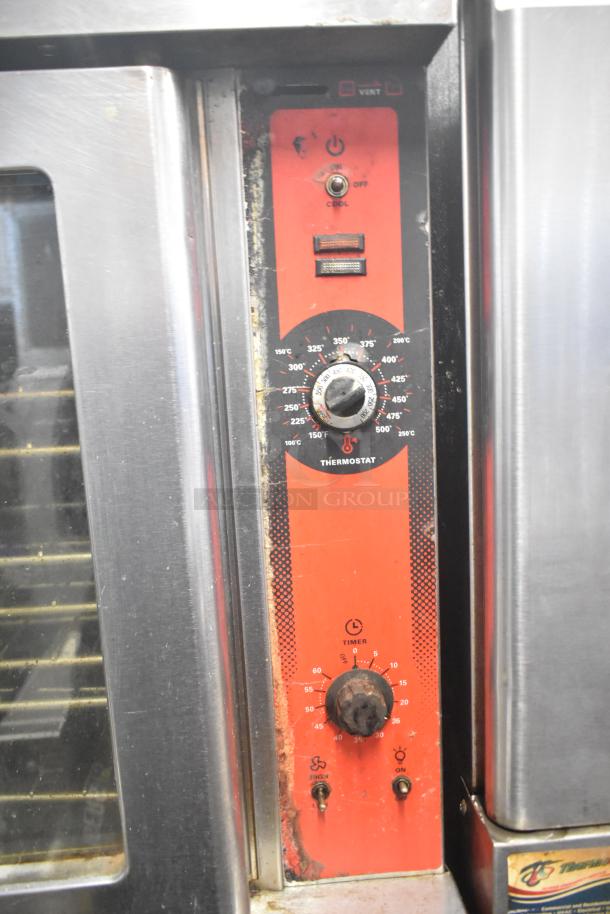 Two Vulcan commercial convection ovens with view-through doors, thermostatic controls, and visible wear.