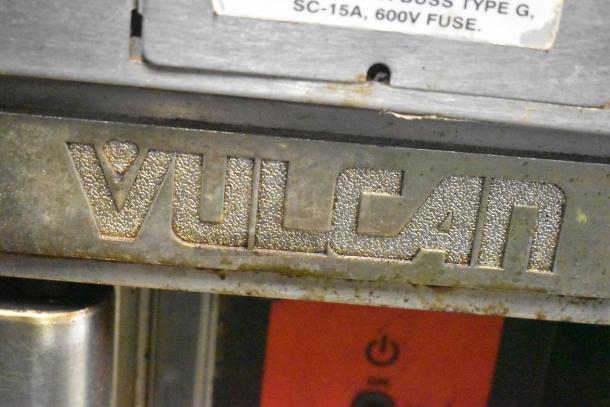 Vulcan commercial convection oven logo, metallic finish, slight wear, label indicates 15A, 600V fuse requirement.