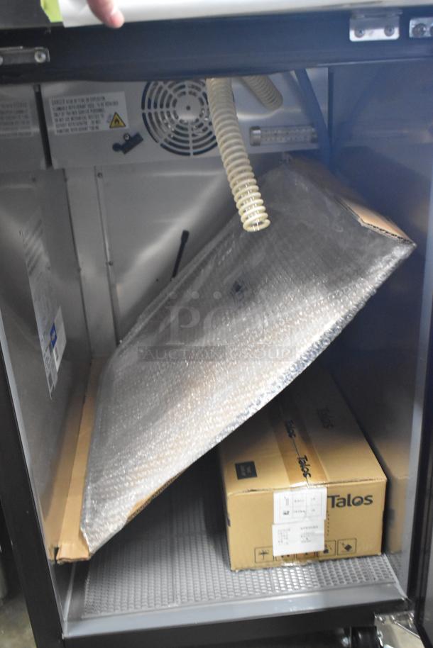 Brand new Avantco UDD-1-HC kegerator interior; includes wrapped components and boxed accessories. Scratch and dent condition.