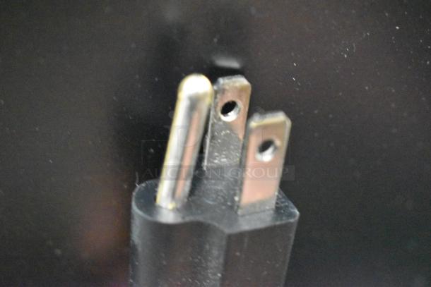 Close-up of a three-prong plug for the Avantco UDD-1-HC kegerator. Plug for 115 volts, 1 phase power.
