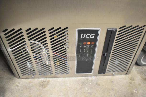 Brand new 2023 Ice-O-Matic UCG 130 GA A undercounter ice machine, 121 lbs, slight dents, 115V, 1 phase, label visible.