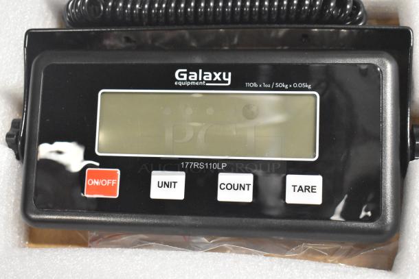 "Brand new Galaxy RS110LP digital scale with remote display, 110 lb. capacity. Model 177RS110LP, minor scratches visible."