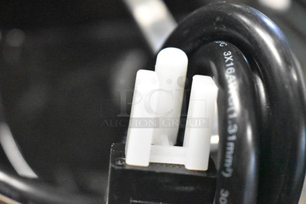 Close-up of a power plug on a new Estella Caffe 236ECEGOD espresso grinder; 120 volts, 1 phase.