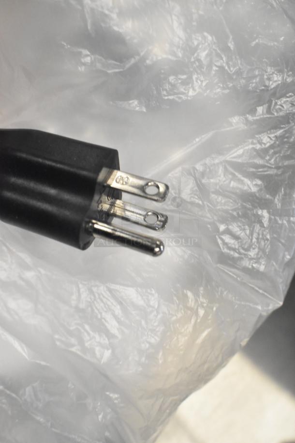 BRAND NEW SCRATCH AND DENT! Estella 348CG12 cheese grater plug. 120 volts, 1 phase. Black plastic and metal prongs.