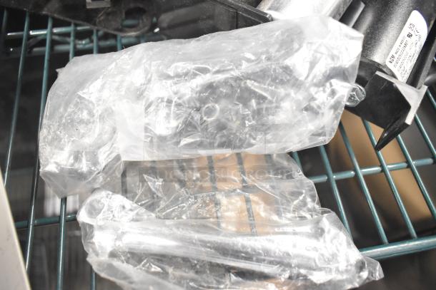 Brand new Embraco NT6222UV motor, scratch and dent, 115V, 1 phase, in packaging on shelf.