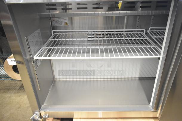 Brand new Avantco 178APT60HC commercial prep table, stainless steel, 115 Volts, scratch and dent condition, visible inside shelving.