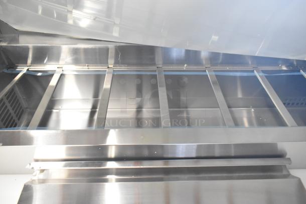 Brand new Avantco commercial pizza prep table, stainless steel, 4 drawers, 1 door, minor scratches, 115 volts, 1 phase.