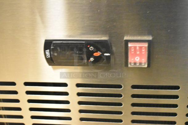 Close-up of thermostat controls on brand new Avantco commercial pizza prep table, 115V, 1 Phase.