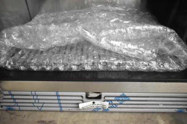 2025 Perlick HC48RS4S Undercounter Cooler, 2 doors, 115V, bubble wrap packaging, label indicating "Remove plunger before operation."