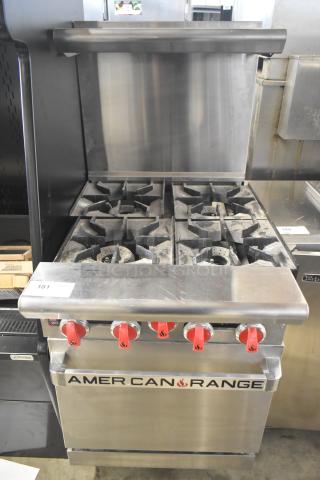 American Range commercial gas 4-burner range with oven, overshelf, and backsplash. Features red knobs, sturdy build, used condition.