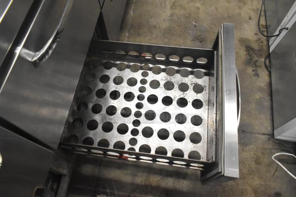 Continental CPA93 pizza prep table with 6 drawers, commercial casters, 115V, 1 phase, stainless steel, shown with open perforated drawer.