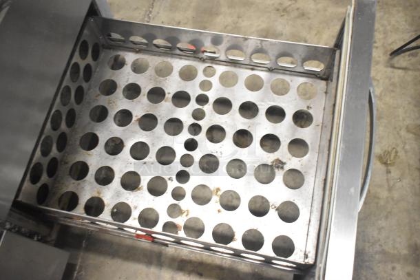 Continental CPA93 pizza prep table drawer interior, stainless steel, perforated for ventilation, commercial use, visible wear.