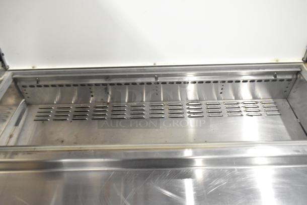 Continental CPA93 commercial pizza prep table, stainless steel, 6 drawers, on casters, 115V, visible wear inside.