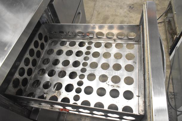 Continental CPA93 Commercial Pizza Prep Table with open drawer, showing perforated metal interior, on commercial casters.