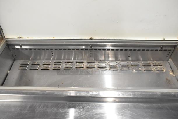 Continental CPA93 pizza prep table, stainless steel, 6 drawers, commercial casters. Shows signs of use, 115V, 1 Phase.