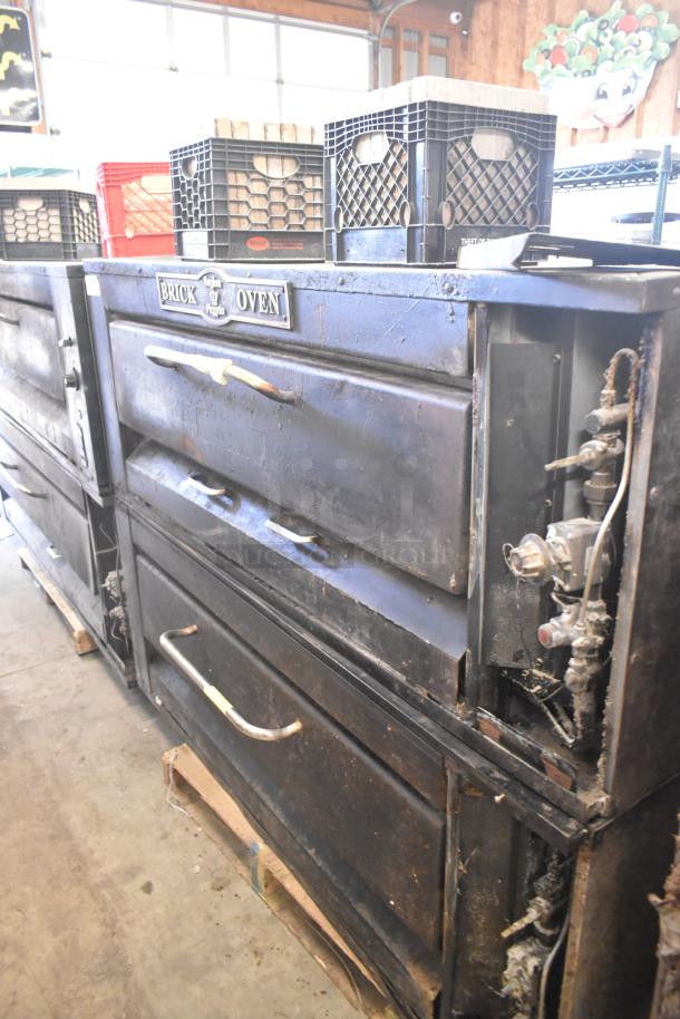2 commercial single deck pizza ovens, used, with "Brick Oven" label. Features sturdy handles, visible wear, ideal for high-volume cooking.