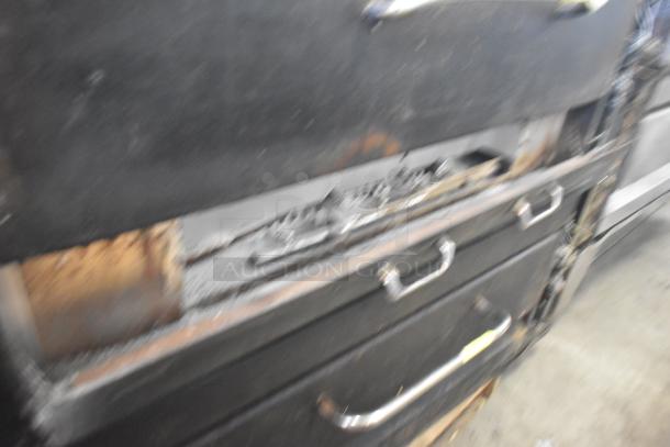 Two commercial single deck pizza ovens with metallic handles, showing signs of use. Ideal for high-demand kitchens.