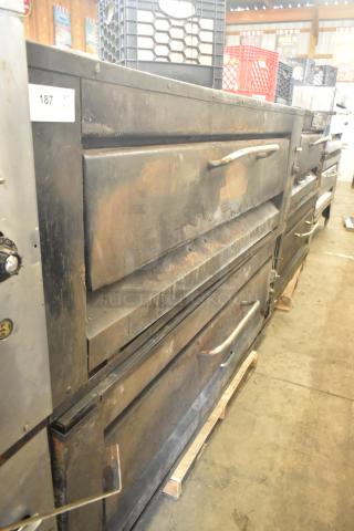 Two commercial single deck pizza ovens, robust build, showing signs of wear. Auction tag: 187, bid quantity: 2 times.