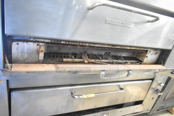 2 Montague 14-P-1 commercial pizza ovens with cooking stones. Natural gas, single deck, stainless steel, some wear.