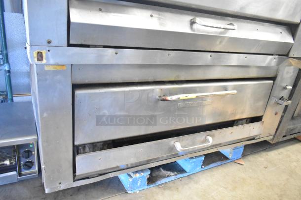 2 Montague 14-P-1 gas pizza ovens with cooking stones; commercial grade, stainless steel, used condition.