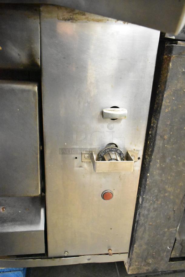 Montague 14-P-1 commercial natural gas pizza oven, stainless steel, with cooking stones and control dial visible. Used condition.