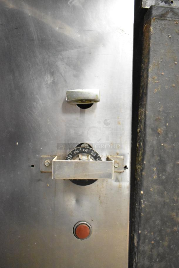 Montague 14-P-1 commercial pizza oven, natural gas, steel exterior, oven door handle, temperature control dial, used condition.