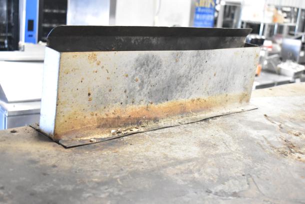 Montague 14-P-1 commercial natural gas pizza oven with cooking stones, shows wear, ideal for heavy-duty use.