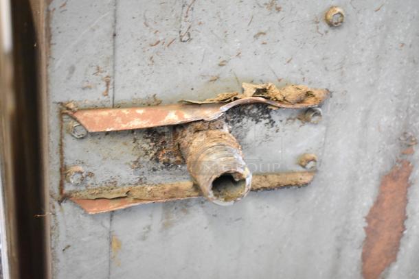 Rusty pipe fitting on a Montague 14-P-1 Commercial Pizza Oven, showing signs of corrosion and wear.