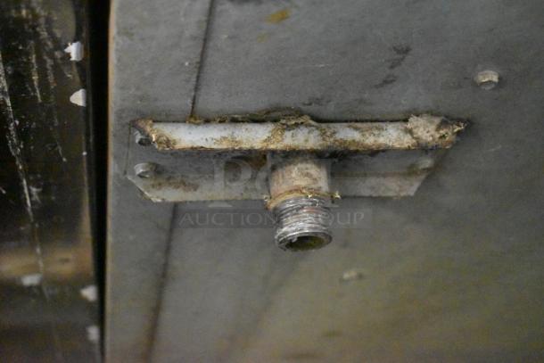 Montague 14-P-1 pizza oven detail showing gas connection, moderate rust present. Suitable for commercial use.