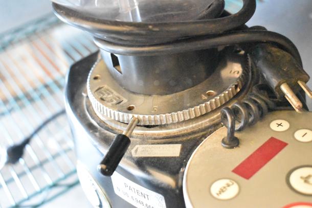 Mazzer Luigi countertop espresso bean grinder, 110 volts, 1 phase. Shows adjustable settings and visible model markings.