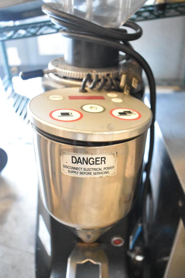 Mazzer Luigi countertop espresso bean grinder, stainless finish, visible warning label, 110V, 1 phase, gently used condition.
