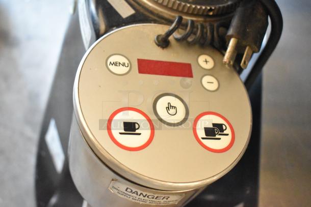 Mazzer Luigi countertop espresso bean grinder, 110 volts, 1 phase. Control panel displays menu, coffee settings, and safety warning.