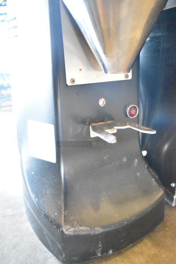 Mazzer Luigi countertop espresso bean grinder, 110V, 1 phase. Features durable metal construction, visible wear on base.