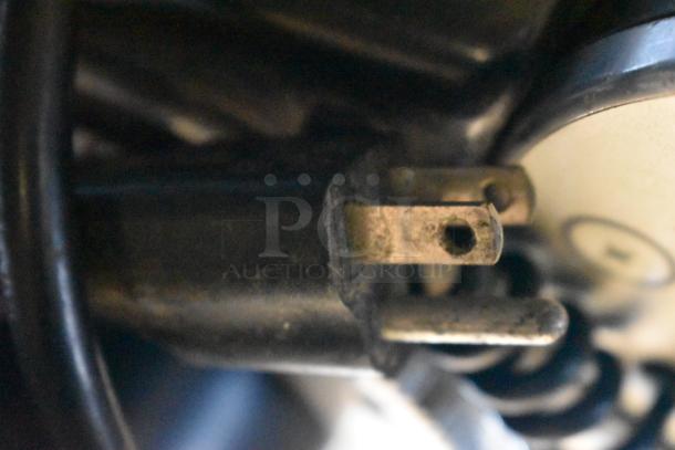 Power plug of Mazzer Luigi Espresso Grinder, 110 Volts, showing wear. Essential component for countertop use.