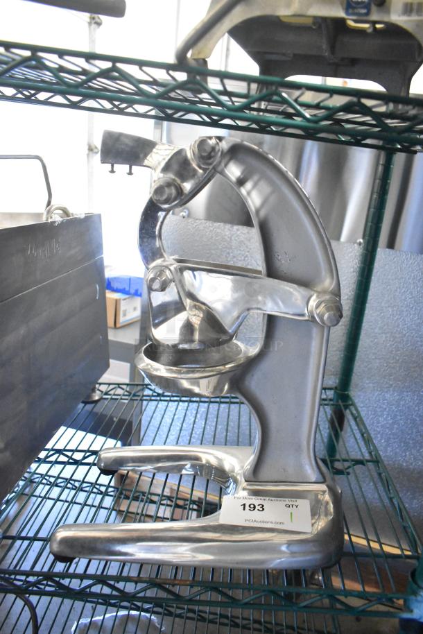 RA Chand Countertop Manual Citrus Juicer, metal finish, sturdy design, good condition, item tag 193 visible.