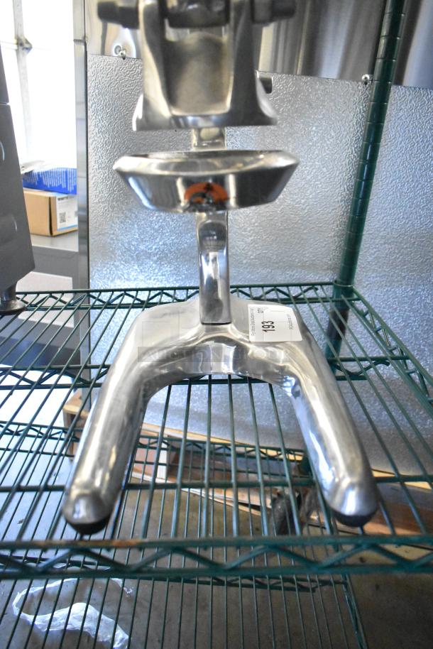 RA Chand Countertop Manual Citrus Juicer, stainless steel, sturdy design. Auction tag marked "198". Good condition.