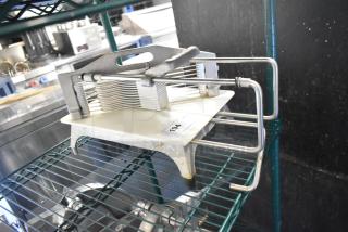 Countertop Tomato Slicer with stainless steel blades, sturdy frame, and a visible tag indicating item number 194.