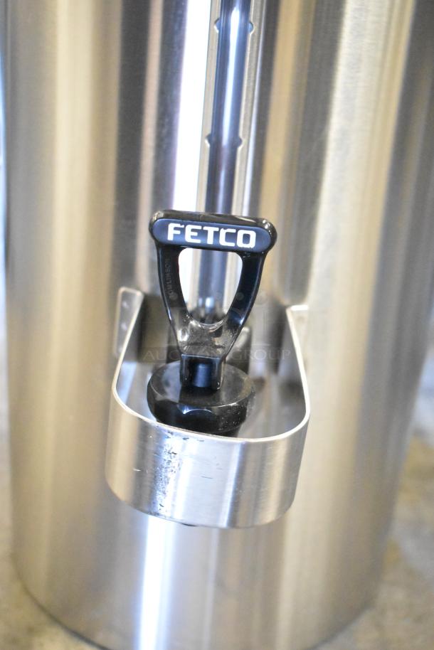 BRAND NEW SCRATCH AND DENT! Fetco TPD-30 Luxus 3-Gallon Stainless Steel Coffee Dispenser; visible Fetco logo.