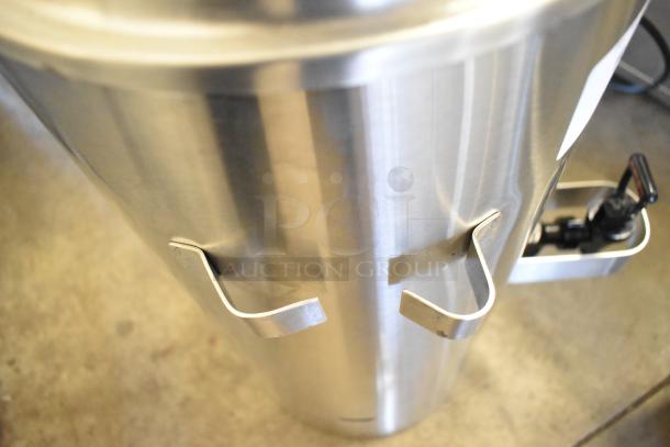 Brand new Fetco TPD-30 Luxus stainless steel 3-gallon coffee dispenser with minor scratches; ideal for high-volume use.