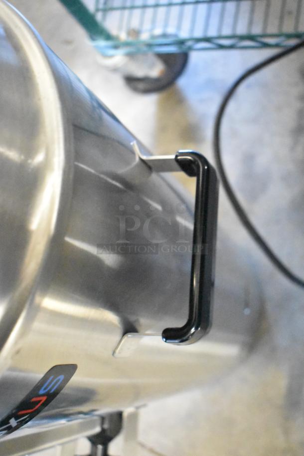 Fetco TPD-30 Luxus 3 Gallon Coffee Dispenser, stainless steel, brand new with minor dents, visible side handle.