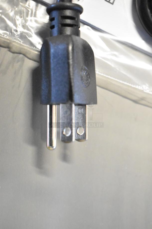 Close-up of a power plug for a Metro 461HS1848 Super Erecta Heated Shelf, showcasing the 120V connector.