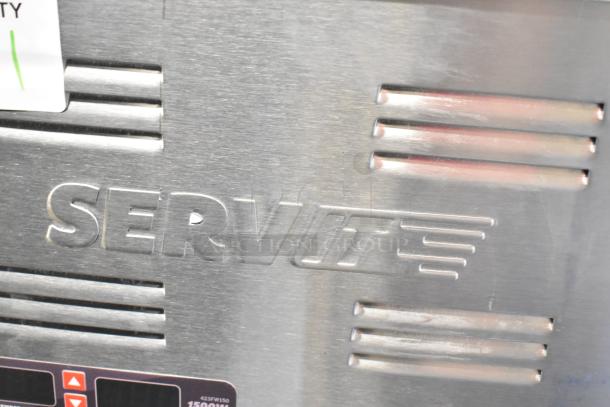 Brand new 2024 ServIt 423FW150 full-size electric food warmer, stainless steel, digital controls, 120V, minor dents visible.
