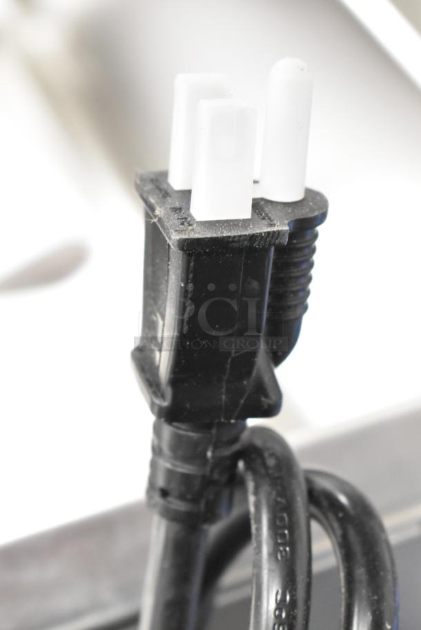 Brand new ServIt 423FW150 electric food warmer plug, showcasing its three-prong design.