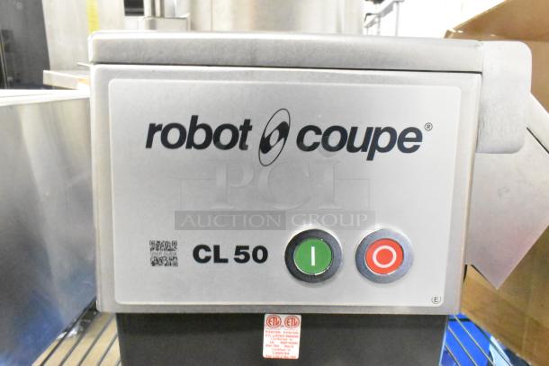 BRAND NEW Robot Coupe CL 50 Series E countertop food processor with blades, 120 volts, 1 phase, slight scratches.