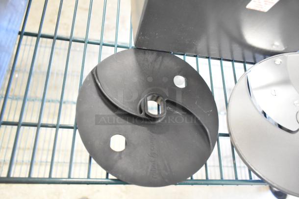 Brand new Robot Coupe CL 50 Series E countertop food processor blades, black with visible manufacturer's markings.