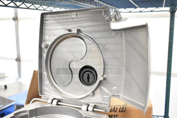 Robot Coupe CL 50 Series E food processor lid with visible branding. New, scratch and dent condition. Includes blades.